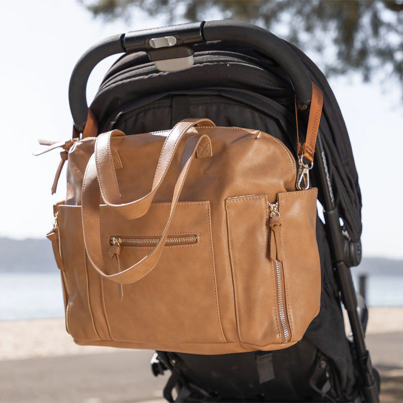 Milaloo diaper bag backpack shown with its top carry handle